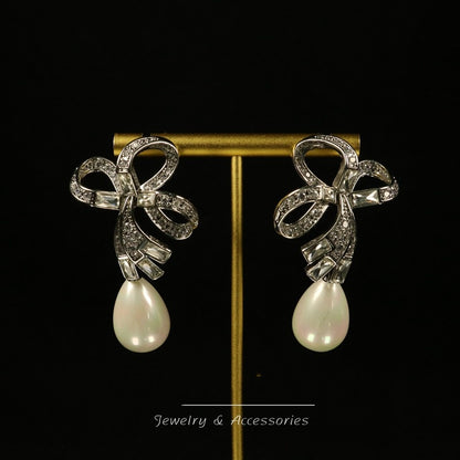 Diamond-Embellished Teardrop Shell Bow Drop Earrings