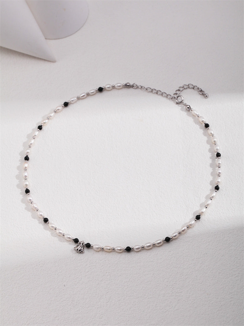 Elegant Necklace with Natural Pearls, Onyx, and Shell Pendant