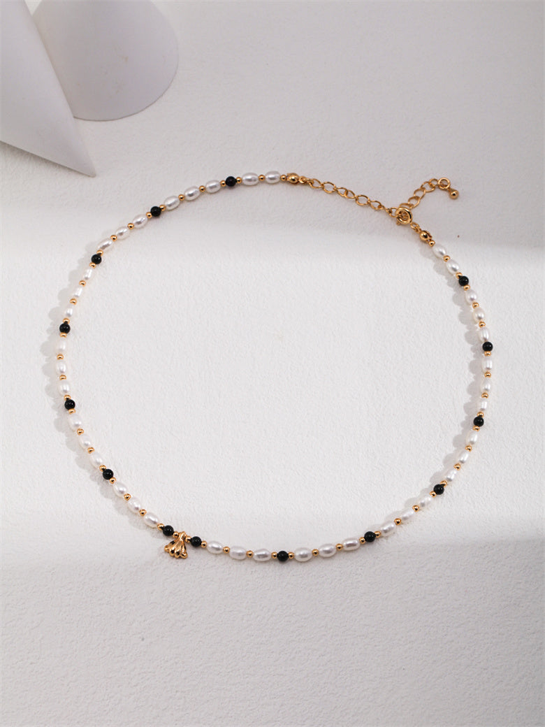 Elegant Necklace with Natural Pearls, Onyx, and Shell Pendant